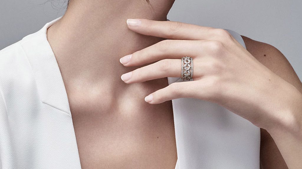 A woman is holding her hand on the side of her body.