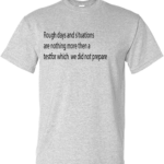 A gray T shirt with a quote that reads Rough days